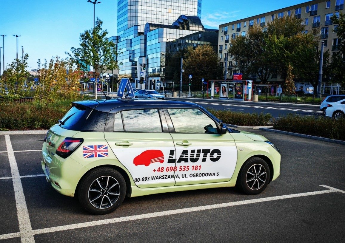 OSK Lauto Suzuki Swift training car with an L plate at ul. Ogrodowa 5 in Warsaw